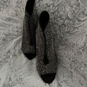 Bejeweled high heel boots.